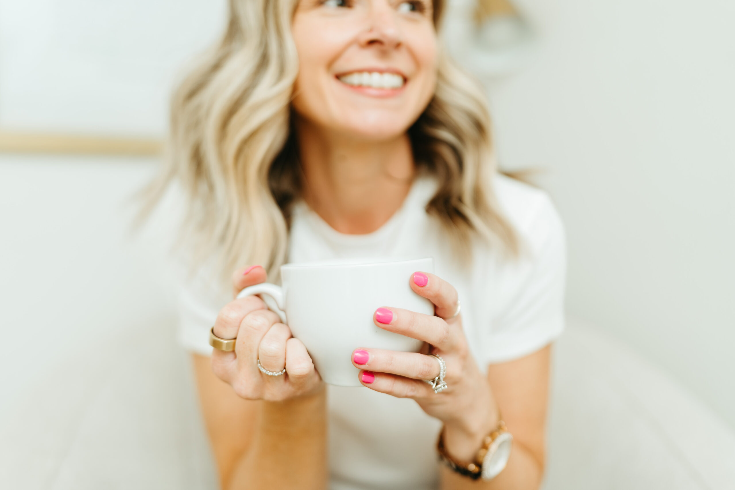 Amanda holding a coffee cup